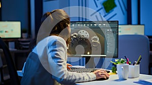 Woman architect working in modern cad program overtime photo