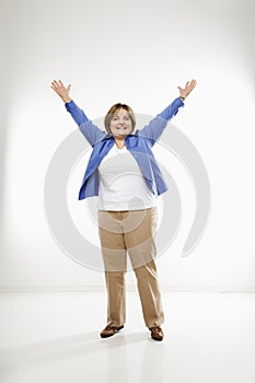 Woman with arms outstretched.