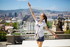 Woman with arms up enjoying sunny day