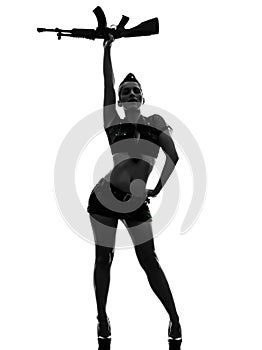 woman in army uniform saluting kalachnikov silhouette