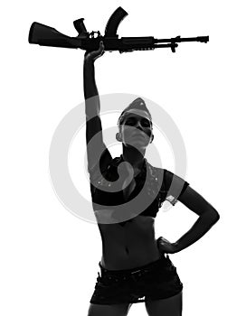 woman in army uniform saluting kalachnikov silhouette