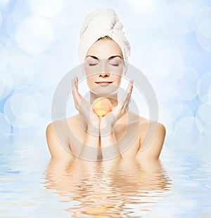 Woman with aroma bath ball