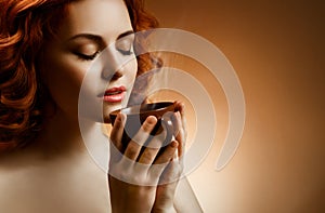 Woman with an aromatic coffee in hands photo