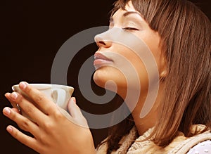 Woman with an aromatic coffee