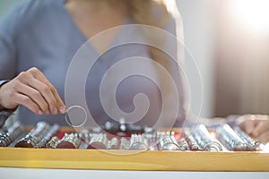 Woman arranging messbrille in tool box