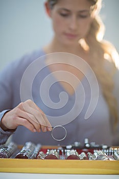 Woman arranging messbrille in tool box