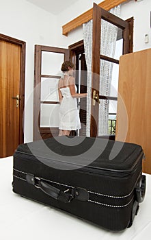 Woman arriving in pension bedroom