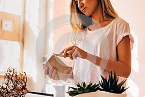 Woman artist molding a clay mug