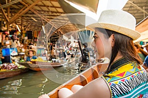 Asian woman looking at vendors pedlar