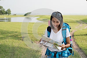 Woman Asia with backpack tourism. traveler in the forest and ma