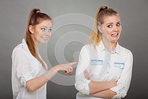 Woman asking apologize to her offended friend after quarrel.
