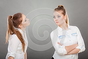 Woman asking apologize to her offended friend after quarrel.