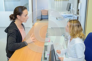 Woman asking patient`s information