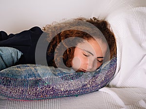 Woman Asleep on a Textured Pillow in a Comfortable Bed