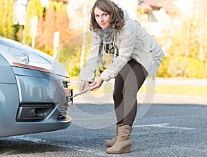 Woman assembling towing hook