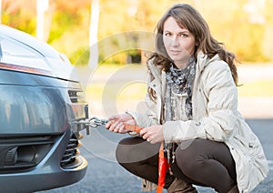 Woman assembling towing hook