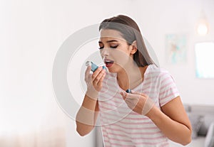 Woman with asthma inhaler