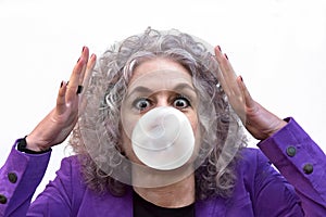 Woman is astonished she has managed to make a thick bubble gum