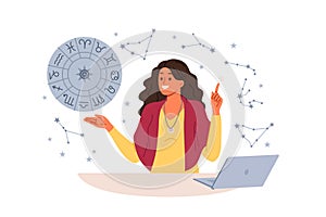 Woman astrologer tells fortunes by horoscope and predicts future by stars, standing near laptop