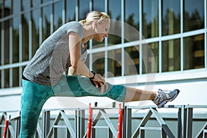 woman athlete doing stretching exercise