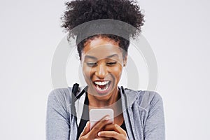 Woman, athlete and phone surprise in studio, victory notification and lottery success. Black model, wow and excited for