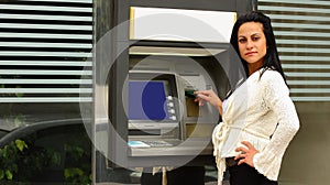 Woman at atm machine outdoor