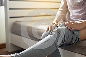 Woman attempt putting or wearing her pant in dressing room