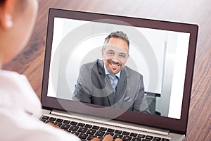 Woman attending video conference