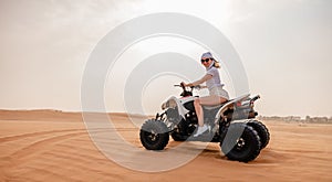 Woman on ATV in the Dubai desert