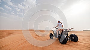 Woman on ATV in the Dubai desert