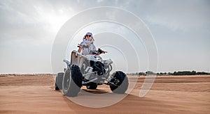 Woman on ATV in the Dubai desert