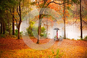 Woman in autumn forest