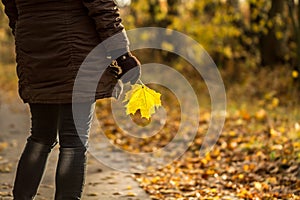 Woman with autumn leaf