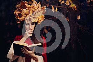 Woman With Autumn Leaves Crown Reading a Book
