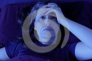 Woman awake bed night insomnia