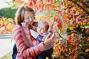 Woman and baby girl outdoors in park