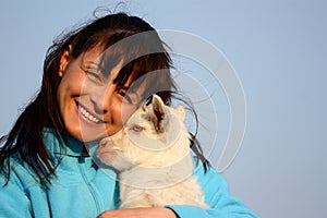 Woman with baby goat (kid)