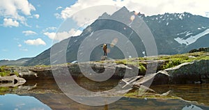 Woman, back and enjoying view of mountains, nature environment or countryside sustainability in Norway. Tourist