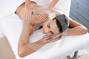 Woman, back massage and body treatment for relaxing, wellness and muscle therapy for bodycare. Female person, masseuse