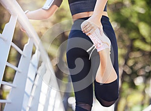 Woman, back and stretching hamstring in park, bridge or outdoor for fitness, health or warm up for training. Girl
