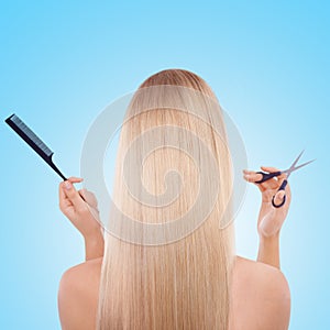 Woman, back and studio with hair, scissors and comb with grooming tools by blue background. Girl, person and model with