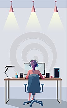 A woman back view operating a desktop computer in a bright room. Remote work.