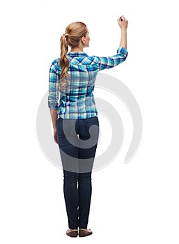 Woman from the back writing something in the air