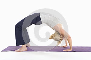 Woman in backbend yoga pose