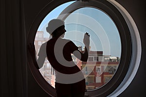 woman on the background of the round window