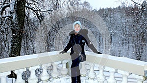 Woman on the background of the winter forest.