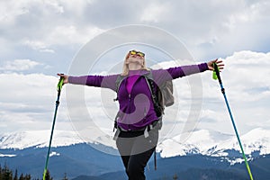 Woman with backpack enjoying the mountain view