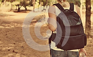 Woman with backpack.
