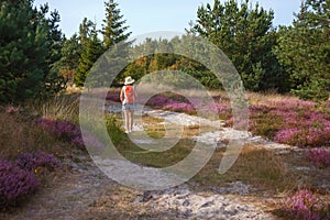 Woman with backpack hiking in nature