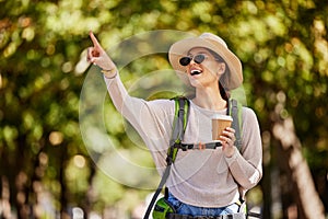 Woman, backpack or pointing in nature travel, sightseeing park or bird watching adventure in trees forest or Canada